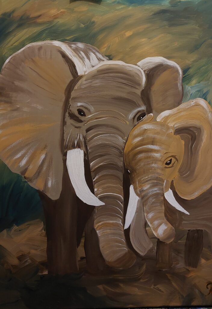 ein kleiner Elefant schmiegt sich an einen großen